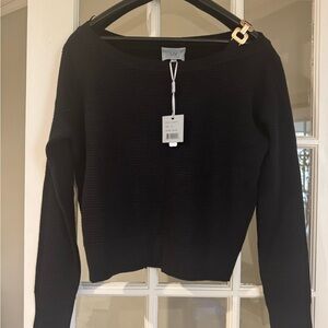 Elegant Black Sweater with Gold Accent
